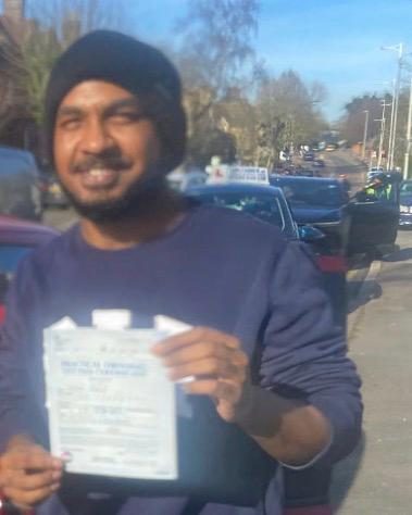 Shahel holding their practical driving test pass certificate after passing with MK Driving School in East London, March 2026